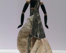 Constantina, 2014, mixed media, folded paper dress on wooden articulated mannequin, 13 1/2 x 6 x 8"