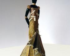 Melpomene, 2014, mixed media, folded paper dress on wooden articulated mannequin, 13 1/2 x 7 x 6"