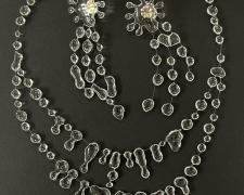 "Splash" (shown with "Rain" necklace), 2024, earrings: UV resin, monofilament, sterling silver, 3 x 1 x 1/8"