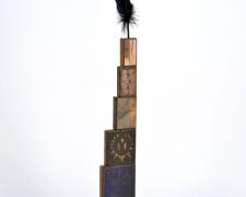 The Ravening Steppes, 2013, printer’s blocks, steel, black feather, 36 1/2 x 10 x 5"
