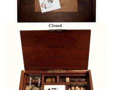 Compliments of the Season, 2007, wood box, lens, dice, vials, cork, darts, watch, paper, glass, 6 x 10 x 1 1/2"