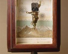 The Vision (No. 9) 2006 Assemblage - wood column base, book illustrations, tintype photograph, plastic figurine, cord, cast iron ceiling fixture part 20 1/4 x 13 1/2 x 8"