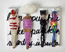 "Likes Spanking", 2023, dolls, paper, adhesive, mixed media, 12 x 16 x 4"