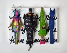 "Turn Around", 2023, dolls, paper, adhesive, mixed media, 12 x 16 x 4"