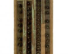 "Opus 1", 2025, assemblage: discarded piano and pump organ pieces, 38 1/2 x 7 x 2 1/2"