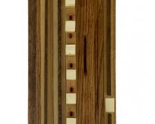 "Opus 4", 2025, assemblage: discarded piano and pump organ pieces, 44 x 8 x 4"