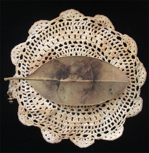 The Beauty from Here, 2011, mixed media, intaglio on magnolia leaf, found objects, 10 x 10"