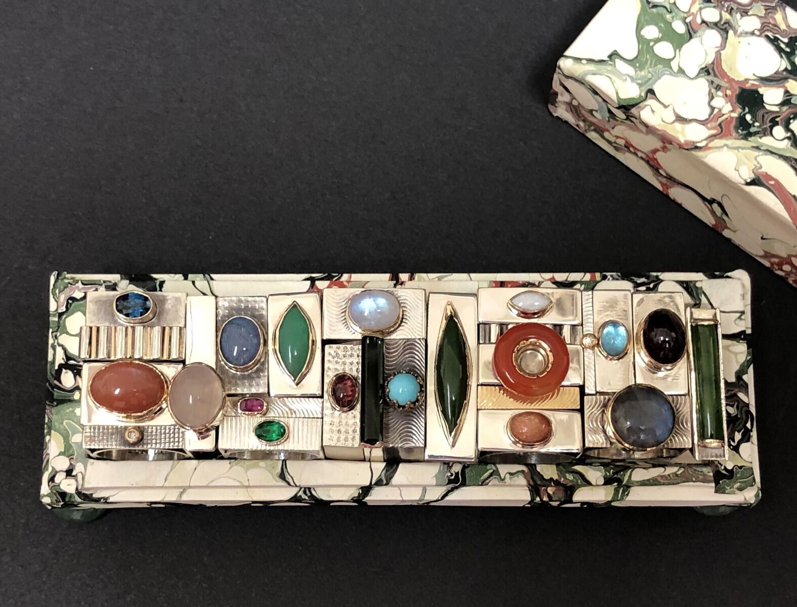 Jewelry Box #10, Klimt, 2019, 24 square and trapezoidal rings, paper, card, sterling silver, 14k and 18k yellow gold, various precious and semiprecious stones, 6 x 2 x 2"