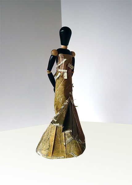 Melpomene, 2014, mixed media, folded paper dress on wooden articulated mannequin, 13 1/2 x 7 x 6"