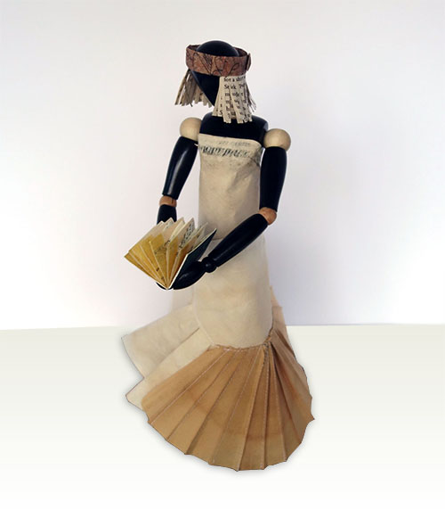 Victoria, 2014, mixed media, folded paper dress on wooden articulated mannequin, 13 1/2 x 6 1/2 x 5 1/2"