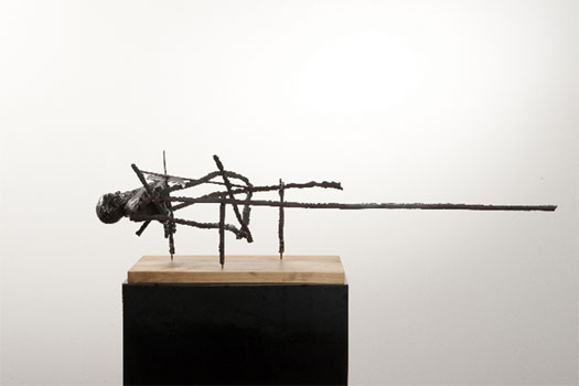 East End, 2009, cast metal bust, steel, wood base, 8 1/2 x 33 1/2 x 7"