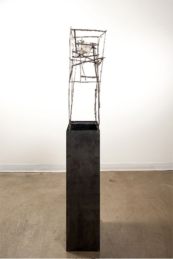 Shiro, 2009, plaster figurine fragment, steel, 68 x 12 1/4 x 11 3/4"